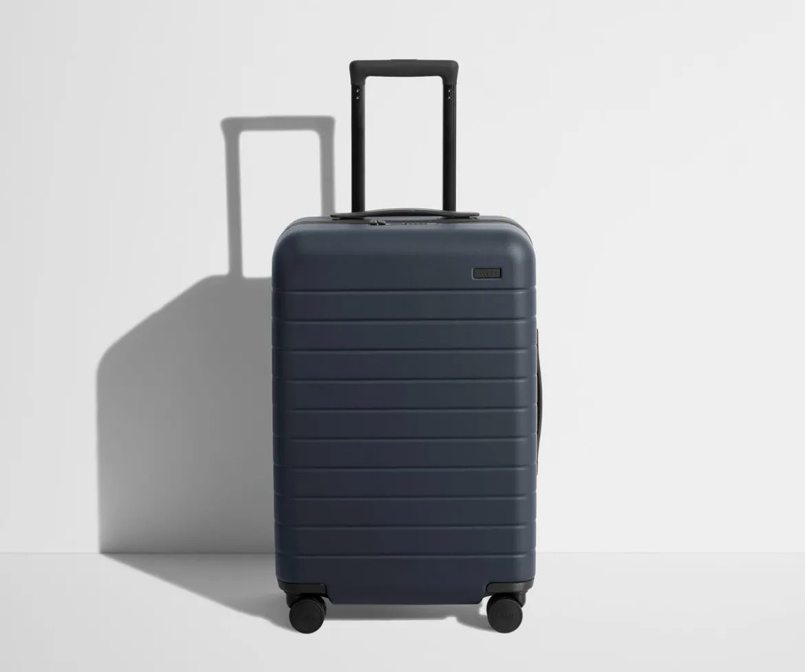 The Bigger Carry-On Flex in Navy Blue
